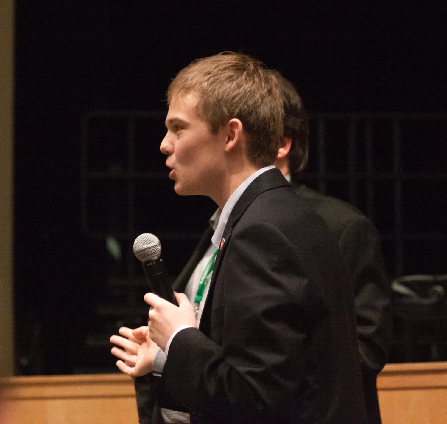 Tyler Ruzich adresses an audience member while answering a question. Ruzich describes himself as a Republican because his parents were able to go to college without government assistance.