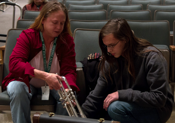 Junior Gabriel Leverette uncases his new trumpet for the first time. Purchasing the instrument himself would have been impossible according to Leverette.