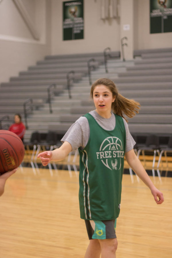 Erin Cushing receives a pass during practice. Realistically we’re not looking at state or like playoffs very much, Cushing said. But I’m here just to make the kids better and maybe get some wisdom into them.