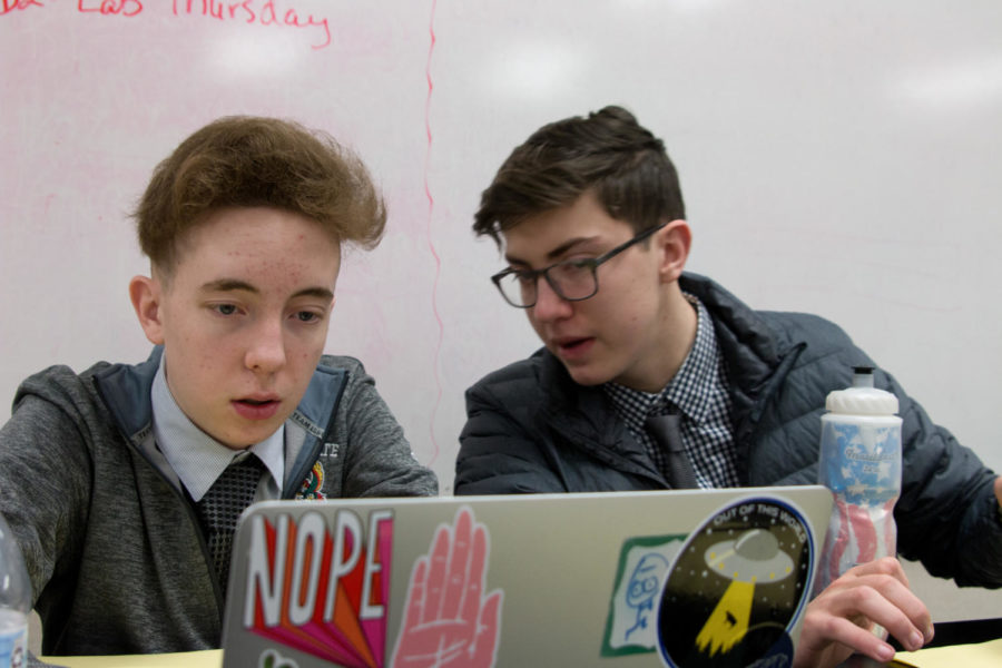 Junior Zach Hill and Alexi Sommerville prepare their arguments before their event at State.