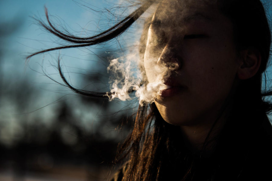 Letting the vapor seep through her lips, a student vapes. “I think that vaping is a good social activity and can help bring people together. However, I think that if someone chooses to vape they should do their own research about the health effects and other consequences because there are some,” The student said.