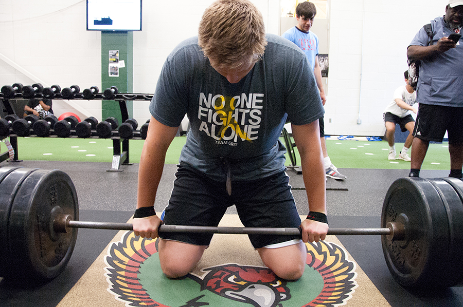 Sophomore Turner Corcoran prepares to begin a workout in the Free State weight room. Corcoran credited his hard work in the weight room for his rise in the rankings.