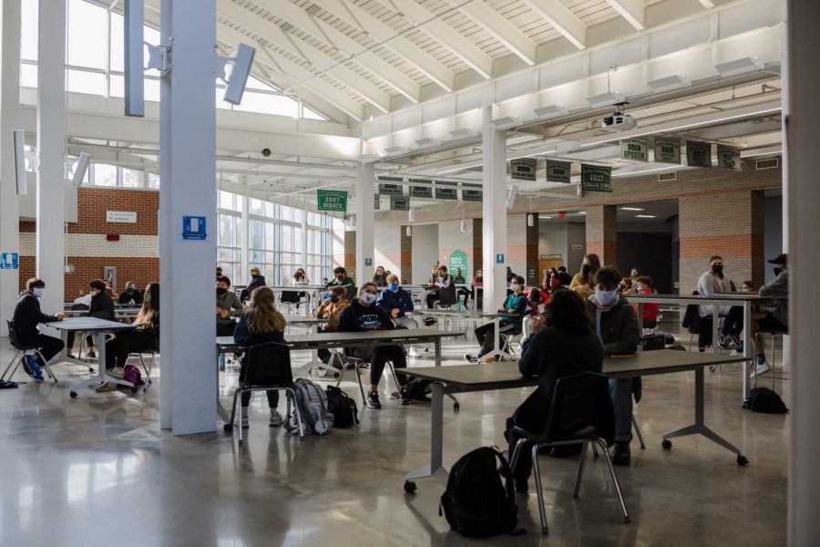 Following the Pre-ACT, freshmen sit waiting in the Commons before touring the building. For many, this was their first time being in Free State. 