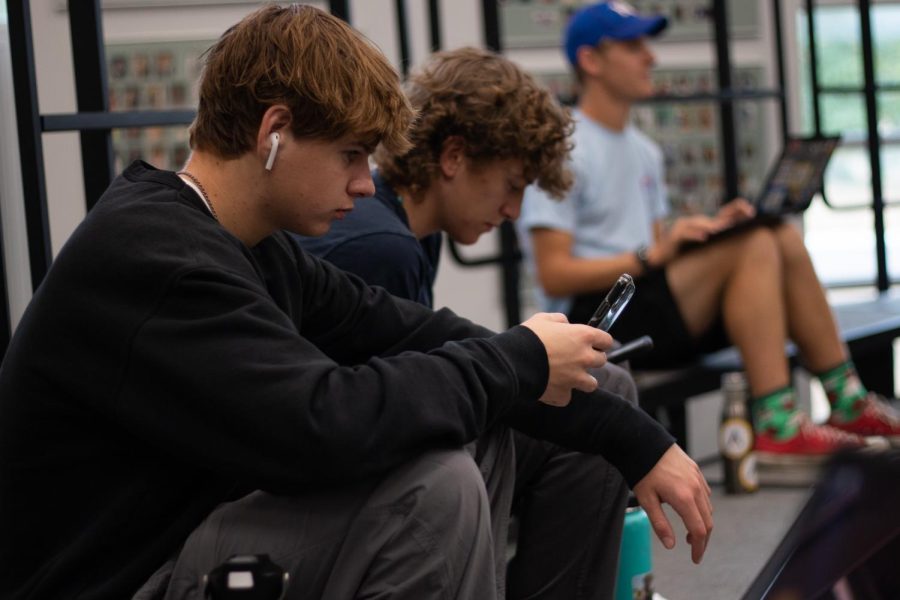 Even during ECT it can be difficult to focus on work instead of looking at your phone and seeing whats new on Snapchat, Instagram etc. Here, senior Sam Girard is on his phone but is still maintaining a fine line of what work there is to do and what is finished.