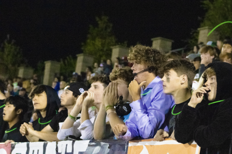 Student section watches the Free State vs. Lawrence High football game. The crowd is dressed as College Gameday. 
