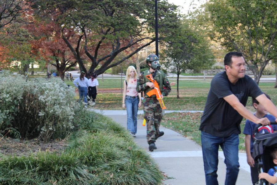 At the zombie walk, there werent just zombies walking around, one person was out looking for safety from the undead. 