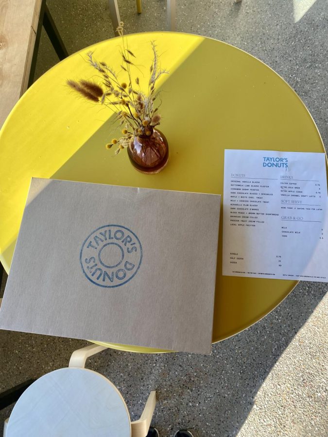 Donuts and menu rest on table at Taylor’s Donuts new location.