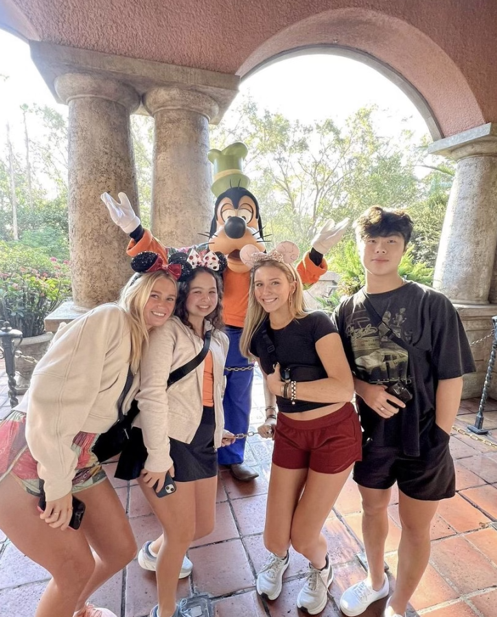 Photo submitted by Evan White. Seniors Alyx Wood, Evan White, Londyn Miller and Mingda Zhang pose with cast member Goofy. 