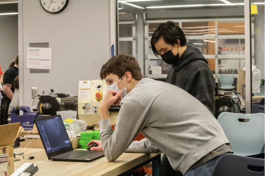 Students on the combined Free State and Lawrence High robotics team work on their robot design. The robot is supposed to be designed to finish a short list of tasks, including maneuvering around obstacles and picking up objects.