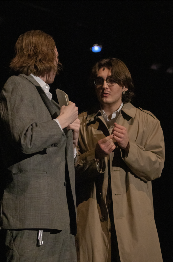  Concealing a ransom note, Samuel Ratchett, played by senior Tommy Taylor, converses with Hector Macqueen, played by senior Felix Janzen Chappell. Taylor has found that putting yourself out there has made theater more of an enjoyable experience. “You just need to put in the effort and you will get something out of theater,” Taylor said. “Thats probably my favorite part, watching someone struggling with inflection or blocking finally breaking through and making the character their own.”