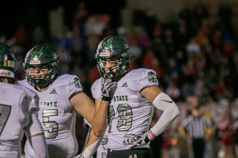 Senior Spencer Doan stands by teammate during the Lawrence High game. The Firebirds won 28-26 on Oct. 14.  