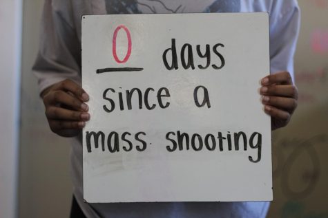 A student holds a board stating 0 days since a mass shooting. According to the Gun Violence Archive, as of April 19, the number of mass shootings in America exceeded 140 for the year of 2023.