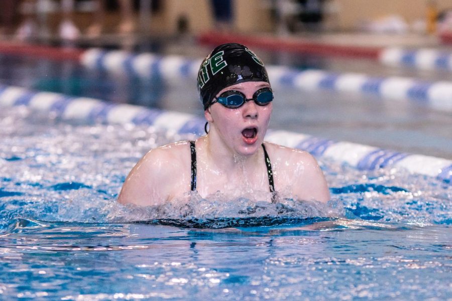 Rising to the surface, junior Sarah Masterson takes a breath between strokes.