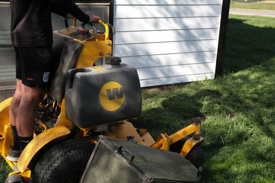 Sophomore Jeremiah Jones works hard while mowing lawns to make money for the summer. “Mowing lawns is a great and easy summer job for high school students,” Jones said.