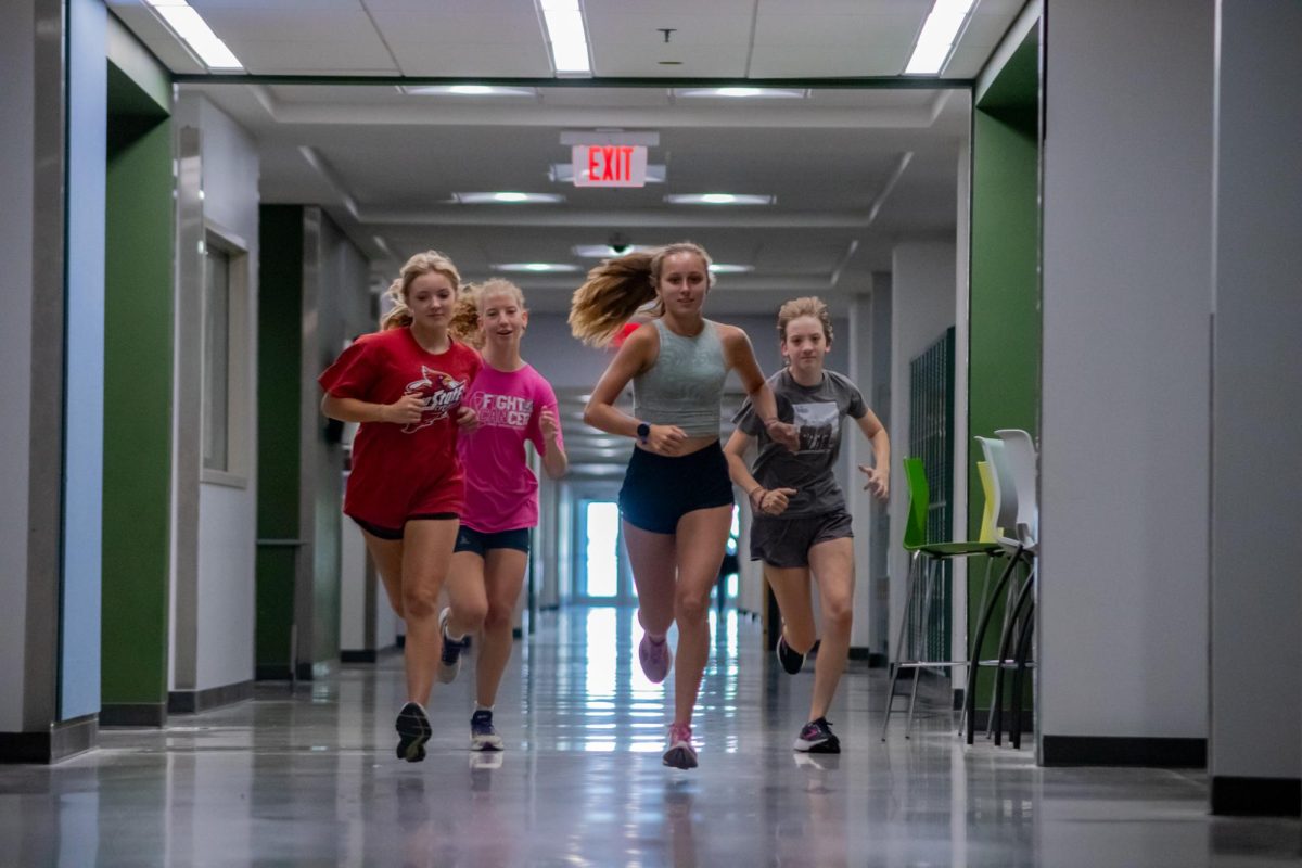 Running the halls, the cross country team practices inside due to a rising heat wave. Having to practice inside isn’t new to the cross country team, according to coach Steve Heffernan. Were used to having to make up some stuff to fill in gaps when the weathers just not accommodating,” Heffernan said.