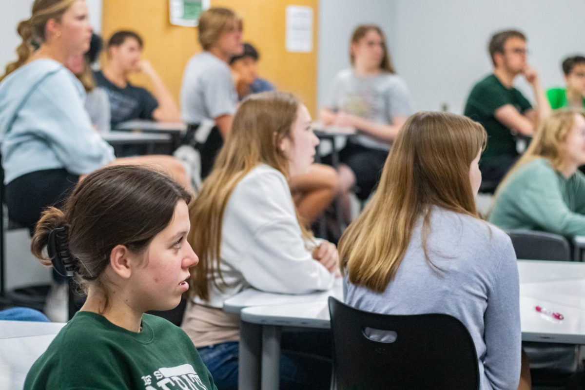  In AP European History, sophomore Olive Minor listens to a lecture. Although a structured college class, their teacher has given them a lot of independence in the class.“We can go at our own pace with the notes,” Minor said. “It’s a lot of self-monitoring which I enjoy.”