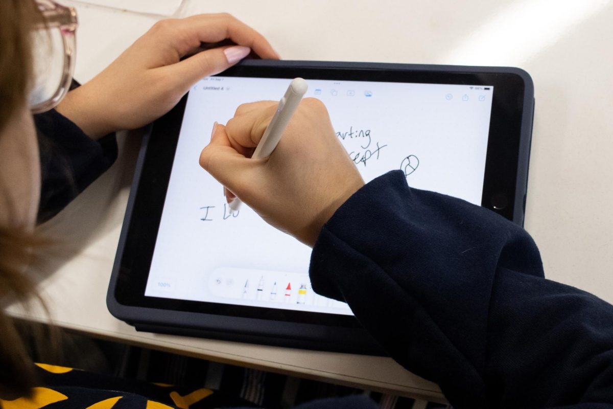 Studying math, sophomore Willow Marable takes notes using her iPad and stylus. While Marable misses having a laptop, she still prefers taking notes online instead of on paper. “I would use my iPad to take notes, because it’s easier to organize and faster to edit than pen and paper, and it also has autocorrect,” Marable said.