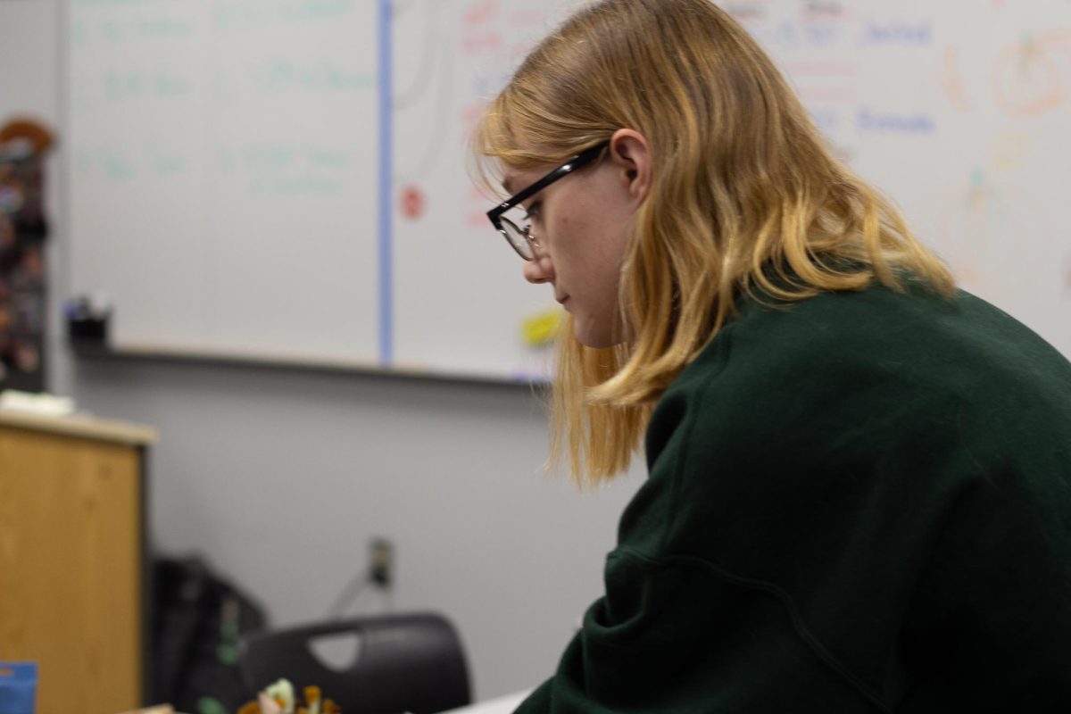 Senior Cella Allison is pictured above at a debate event, Pumpkins and PJs, last fall. 