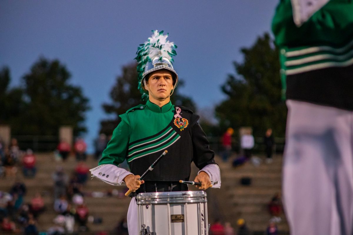 At the Pink Out game on Oct. 10, senior band member Jake Klinger is seen sporting a pink ribbon to raise awareness for breast cancer.