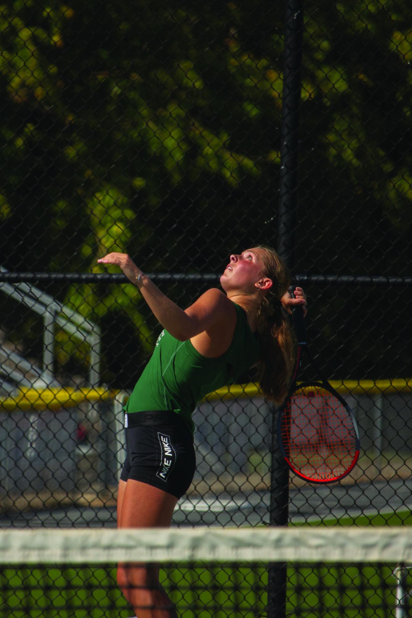 Senior Maya Lee anticipates the ball as she serves. Although this is Lee’s final year with Free State, her tennis journey has not yet reached an end. “I am playing in college and intend to coach to make money during school as well.” Lee said. 