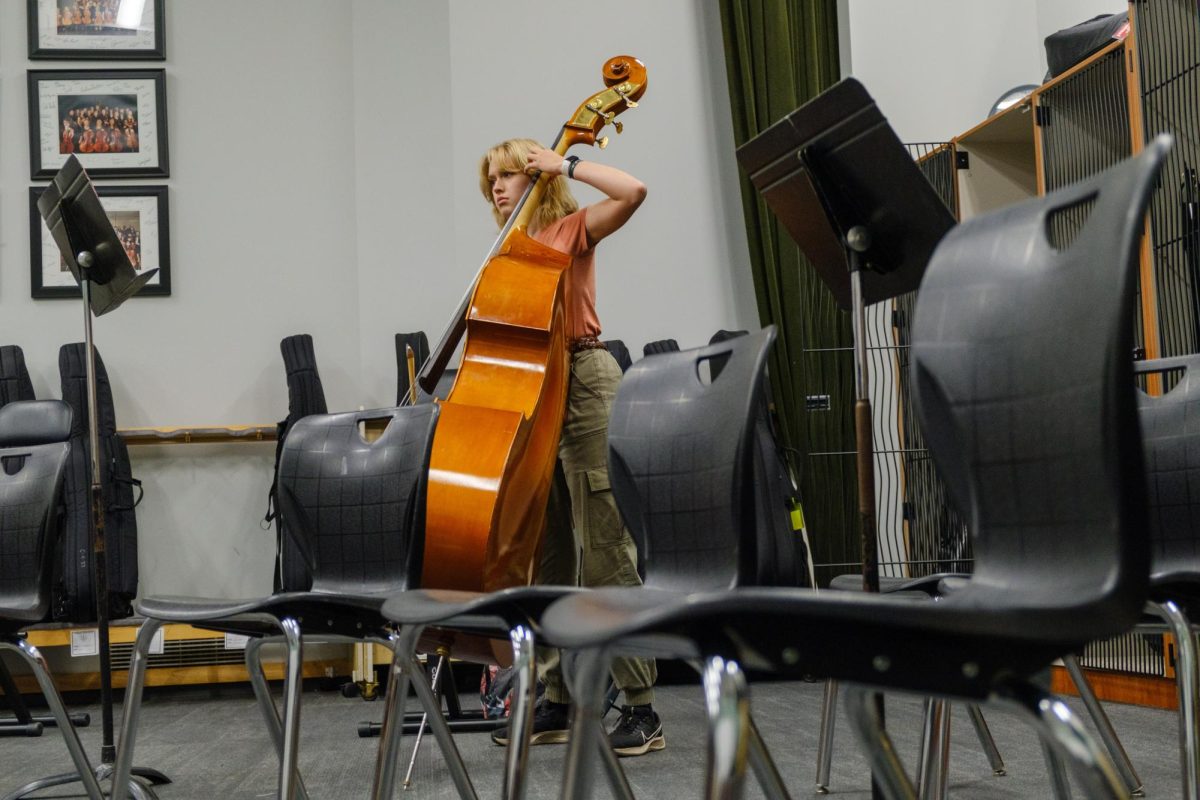 Practicing in the orchestra room, sophomore Annah Steele runs through some scales. Steele plays the string bass for the Symphonic and Chamber orchestras. “I love the unity of [orchestra]. I love everyone working together to put together a single and unified result. Working together to make beautiful music is our common goal,” Steele said.