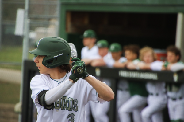 Senior Kyle Graves loads his swing at a varsity game Mar. 31, 2023.