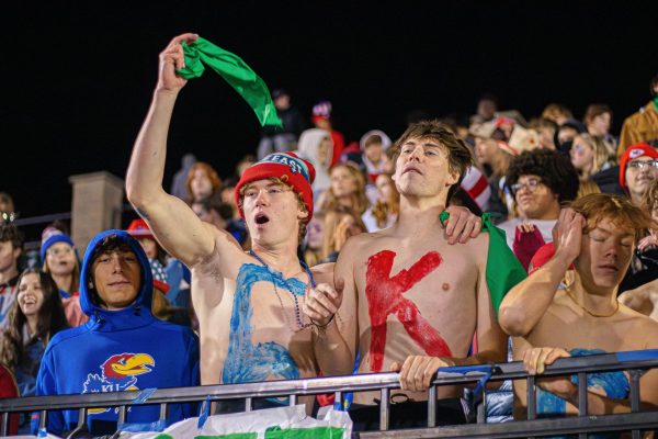 Despite the cold temperature of 40 degrees, Free State students in the student section chant in support of the Football Team at the home game vs Garden City on Oct 27.