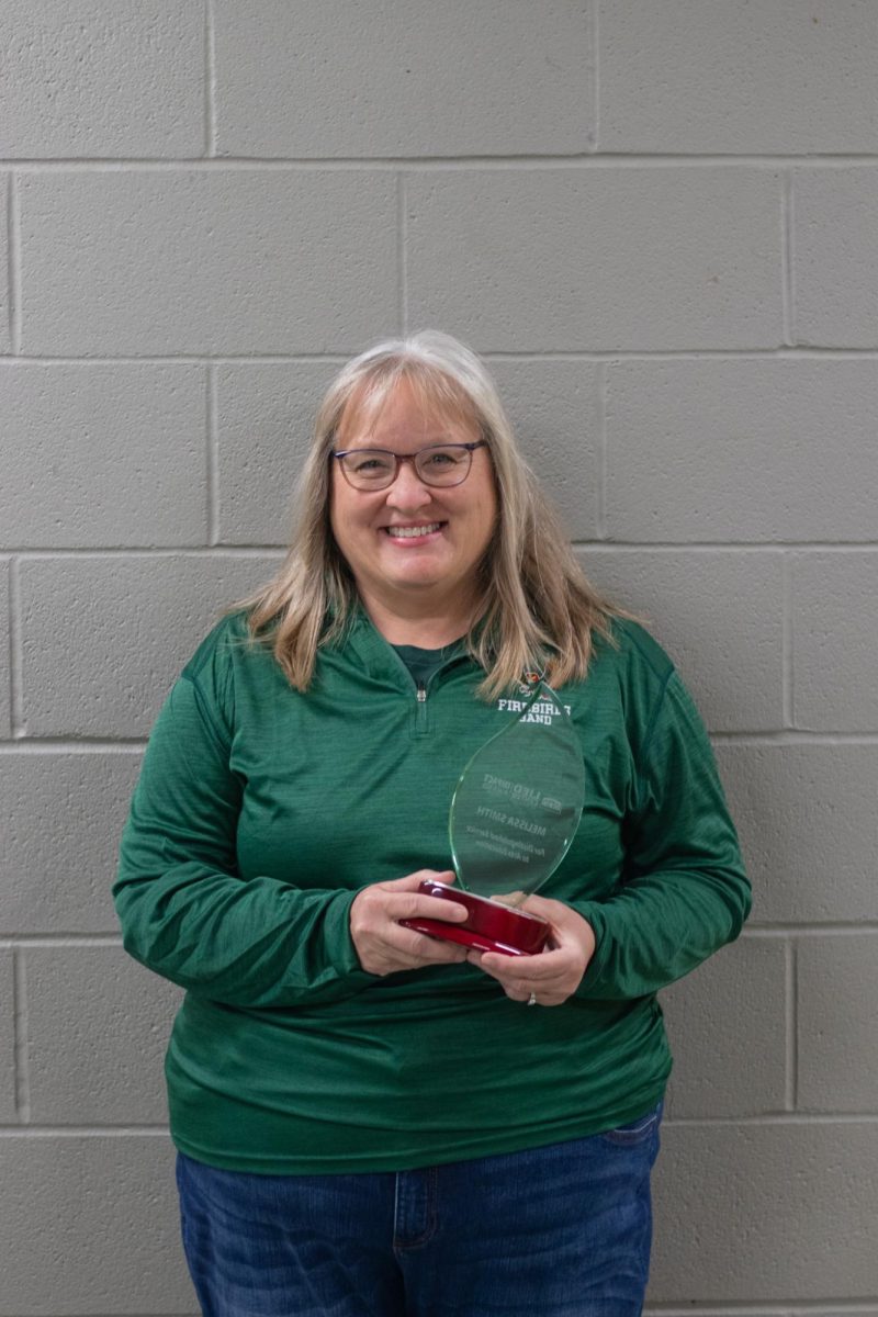 Melissa Smith holds her Lied Center award. Smith has been working in music education for the last 32 years, and teaches at both Free State and West Middle School currently. 