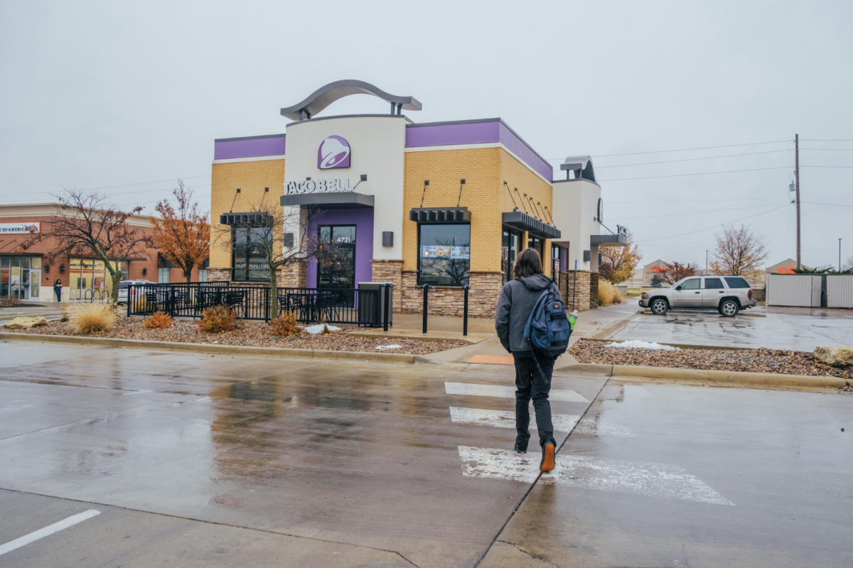 Taking advantage of open lunch, sophomore Miles Beaty walks to Taco Bell. Taco Bell is a popular choice among students because it is close to the school and has reliably fast service. “I enjoy having the choice of open lunch because it is a nice opportunity for students to get some space and fresh air.” Beaty said.