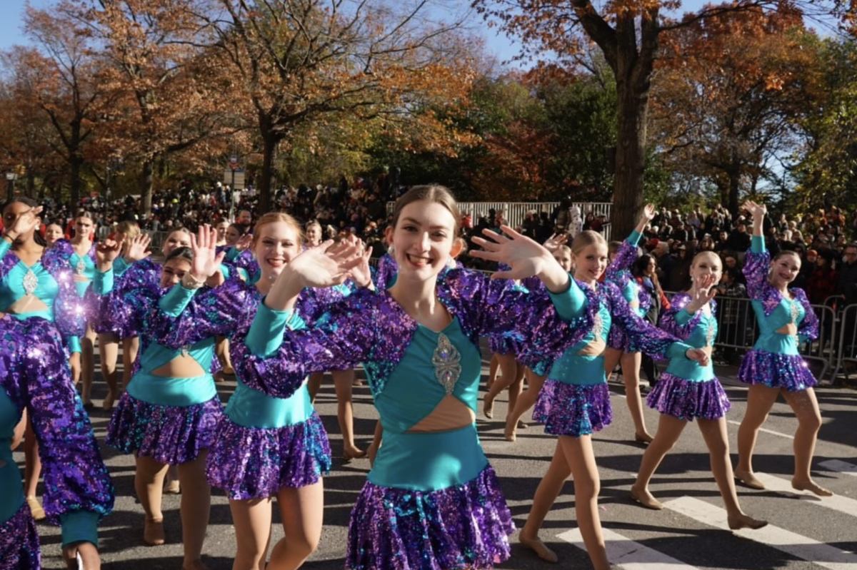 Smiling+in+the+street%2C+junior+Olivia+Hemker+is+surrounded+by+hundreds+of+other+Spirit+of+America+dancers+from+across+the+country.+Photo+collected+from+Olivia+Hemker.