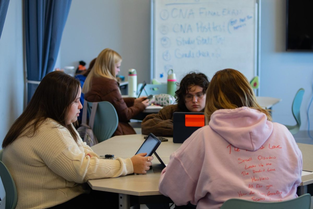 Certified Nurse Aide students review important information before a test. As a partnership with Neosho County Community College, students had the opportunity to earn college credit by taking the class. 
