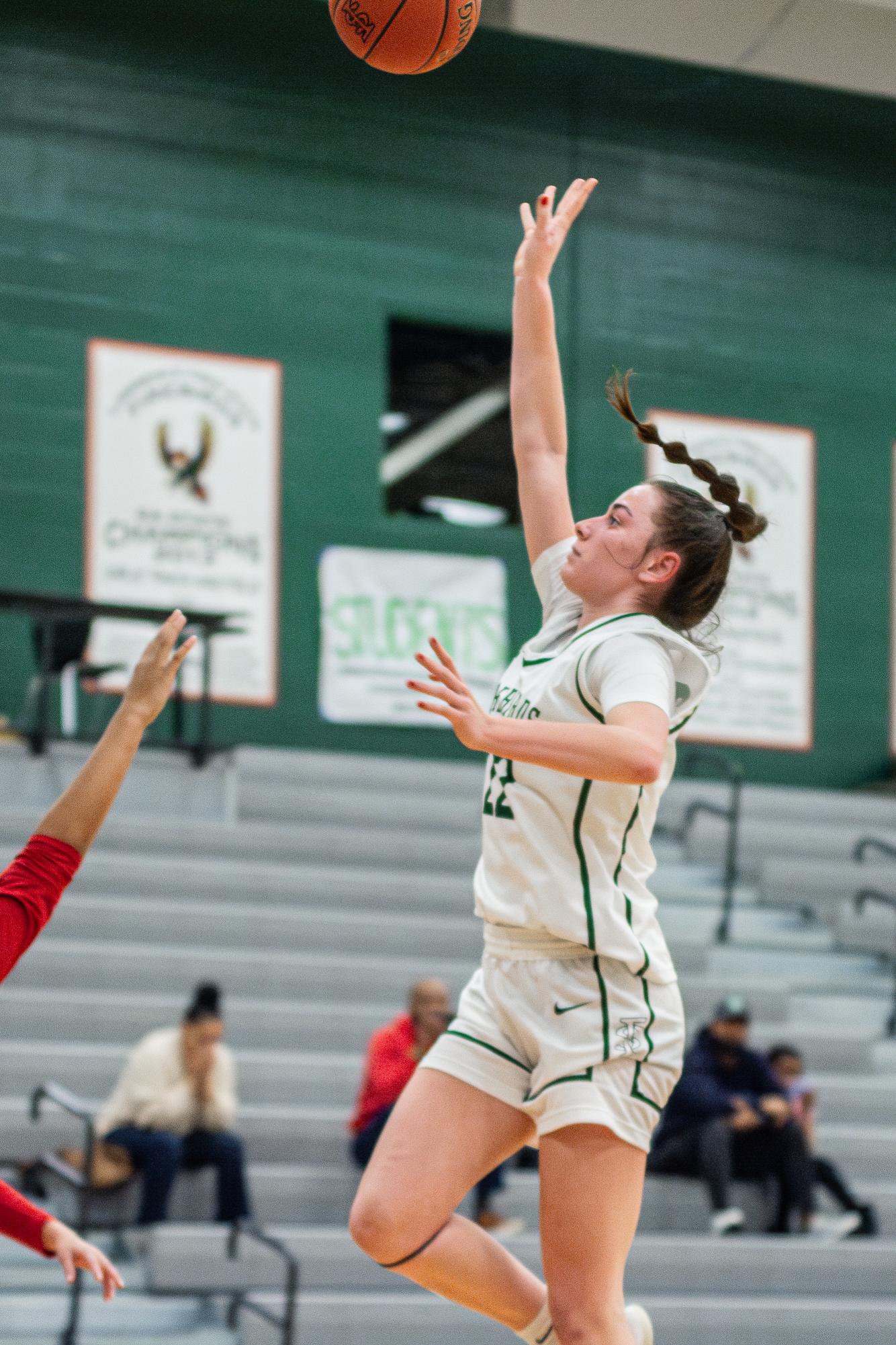 Freshman Anniston Clark goes for a layup during the home varsity girls basketball game vs Olathe North on January 10. 
