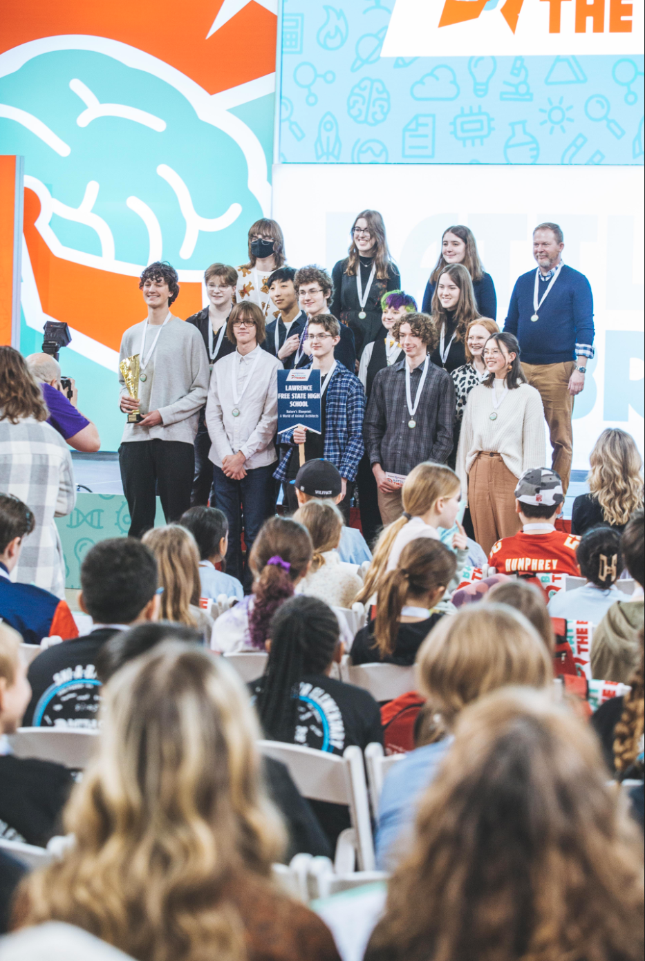 Wearing their medals and holding their trophy, FSHS students after their success at Battle of the Brains. 