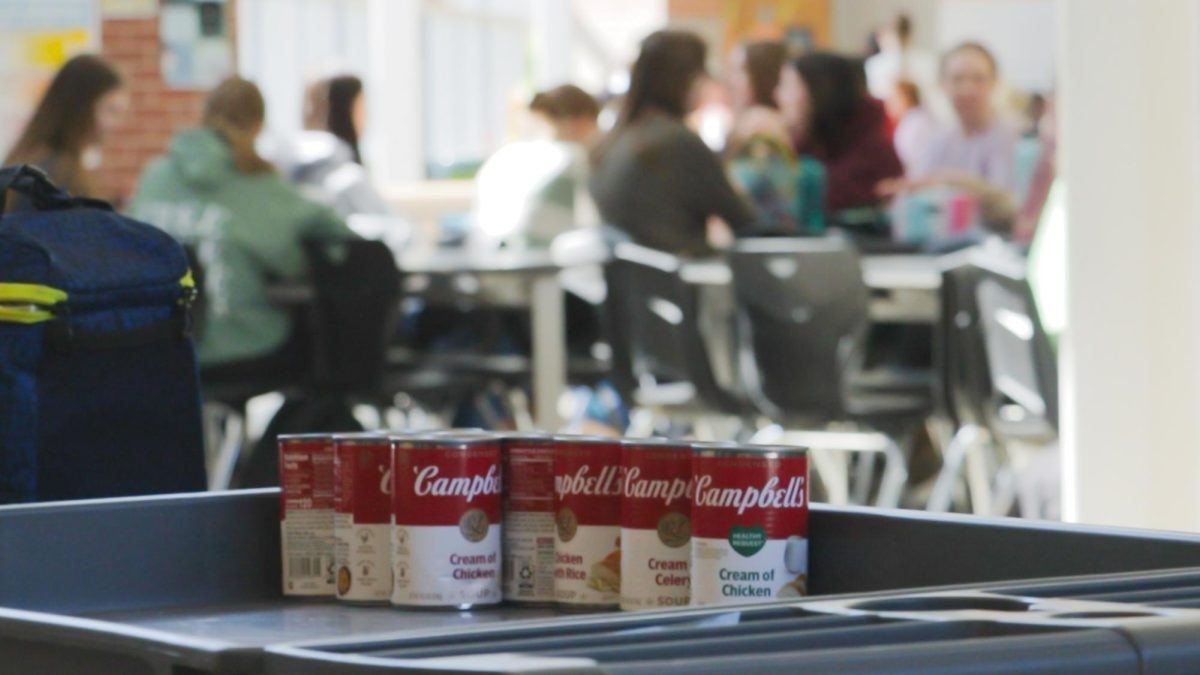 Donated cans sit on the Student Council cart during lunch on March 19, 2024. StuCo representatives accepted donations during lunch before the first March Madness games in a bracket challenge.