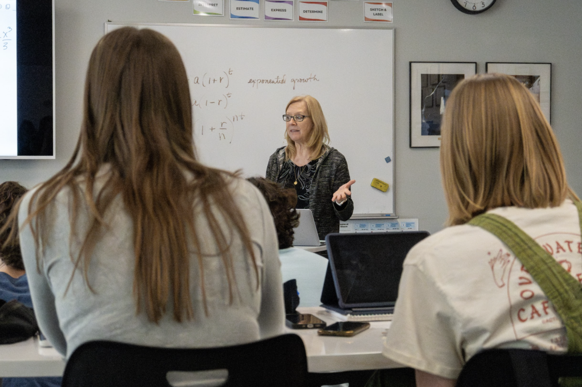 At the front of the class, math teacher Annette McDonald teaches AP Calculus BC to sophomores, juniors and seniors. McDonald prepares students for the AP exam by giving them practice tests and review problems. “Mrs. McDonald encourages us daily to try new strategies to study and prepare,” junior Adele Buren said. “She always lets us ask peers for help if we need it [too].” 
