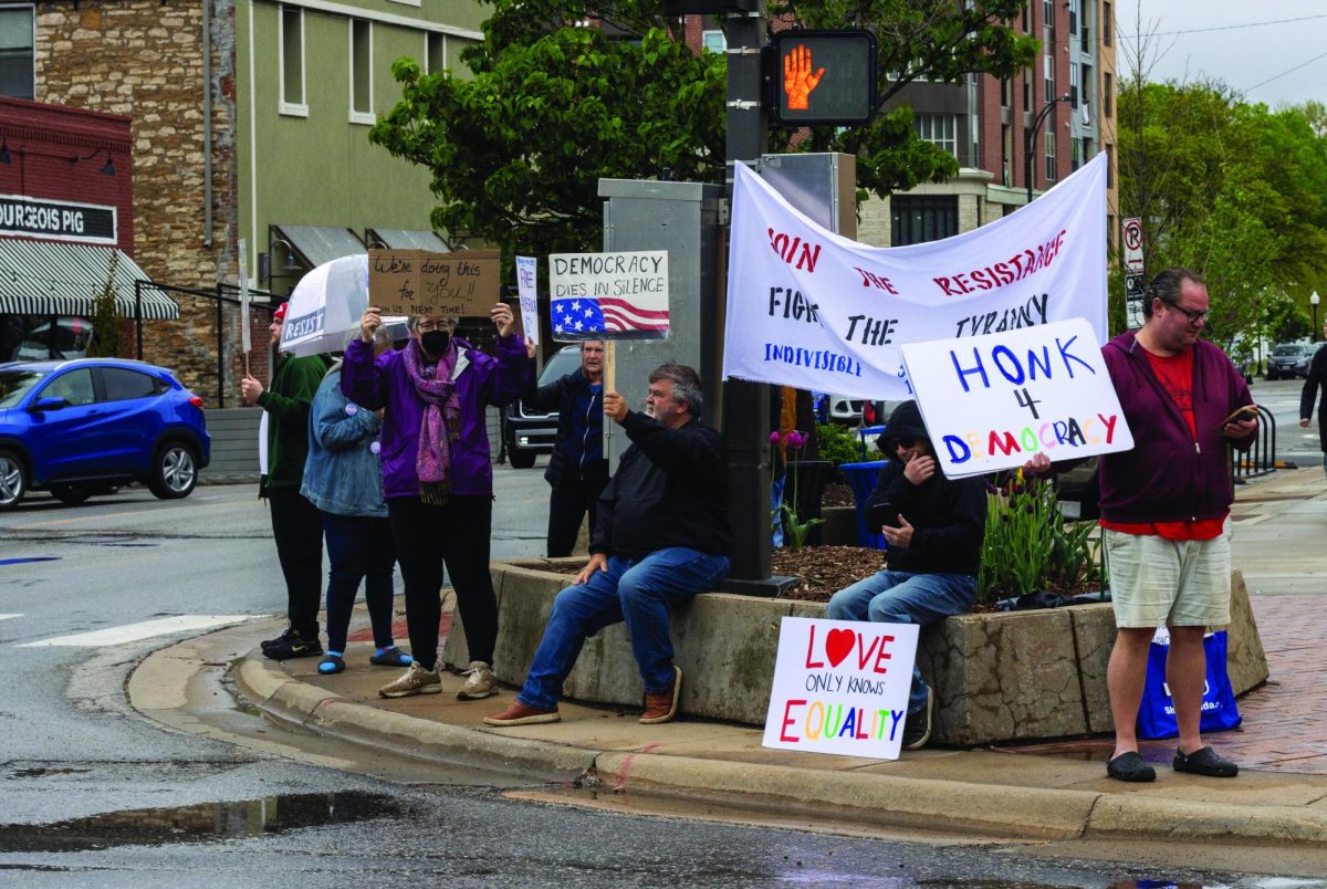 Protesting, a group of individuals join together on Easter to continue their weekly Sunday protest. “Our constitution is being decimated by the Trump administration. They only care about their billionaire friends,” Anda Arms said.