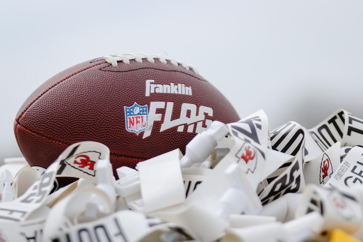 A football rests atop a pile of belts and flags, provided by the KC Chiefs for the flag football clinic on April 9, 2025