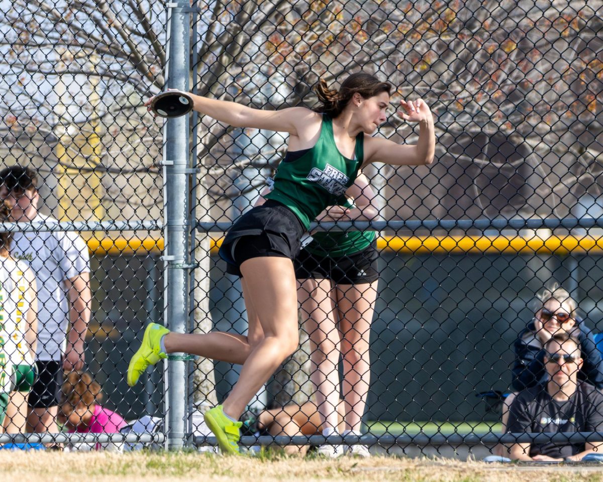 Getting ready to launch, sophomore Sadie Reynolds participates in discus for Free State Track and Field.
