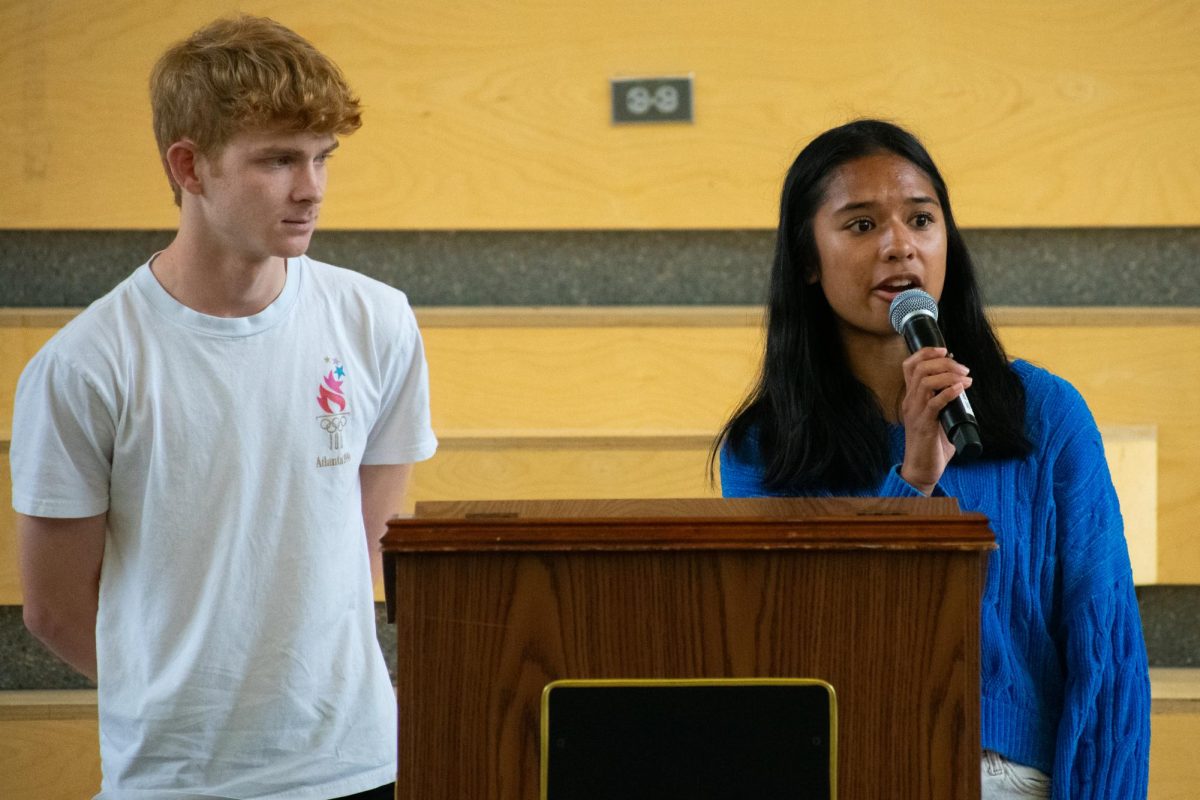 Giving a speech, juniors Julia Velasco and Kyle Sikes explain their policies.