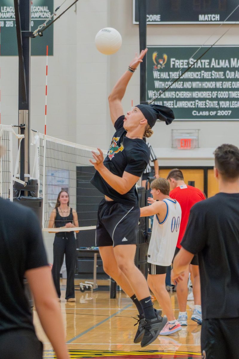 Junior Kaiden Helm spikes the ball during Vol-He-Ball.