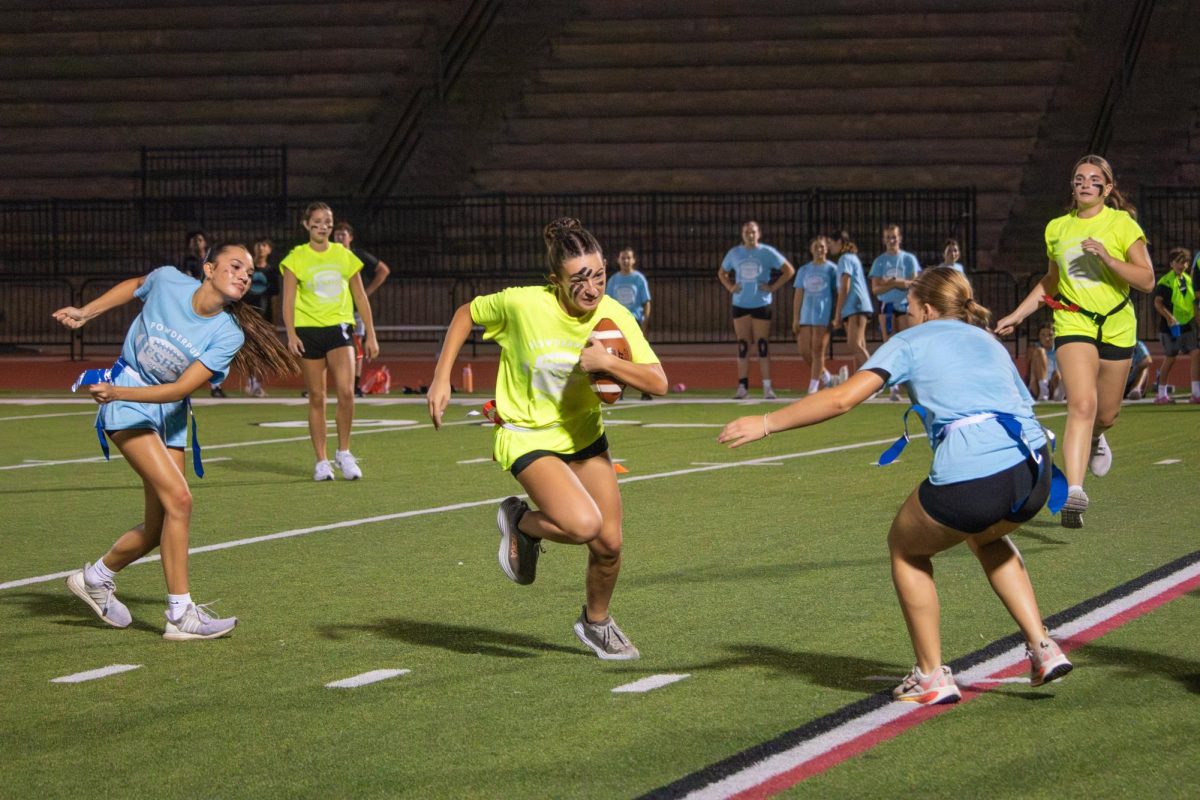 Madeleine Landry rushes the ball for the seniors.