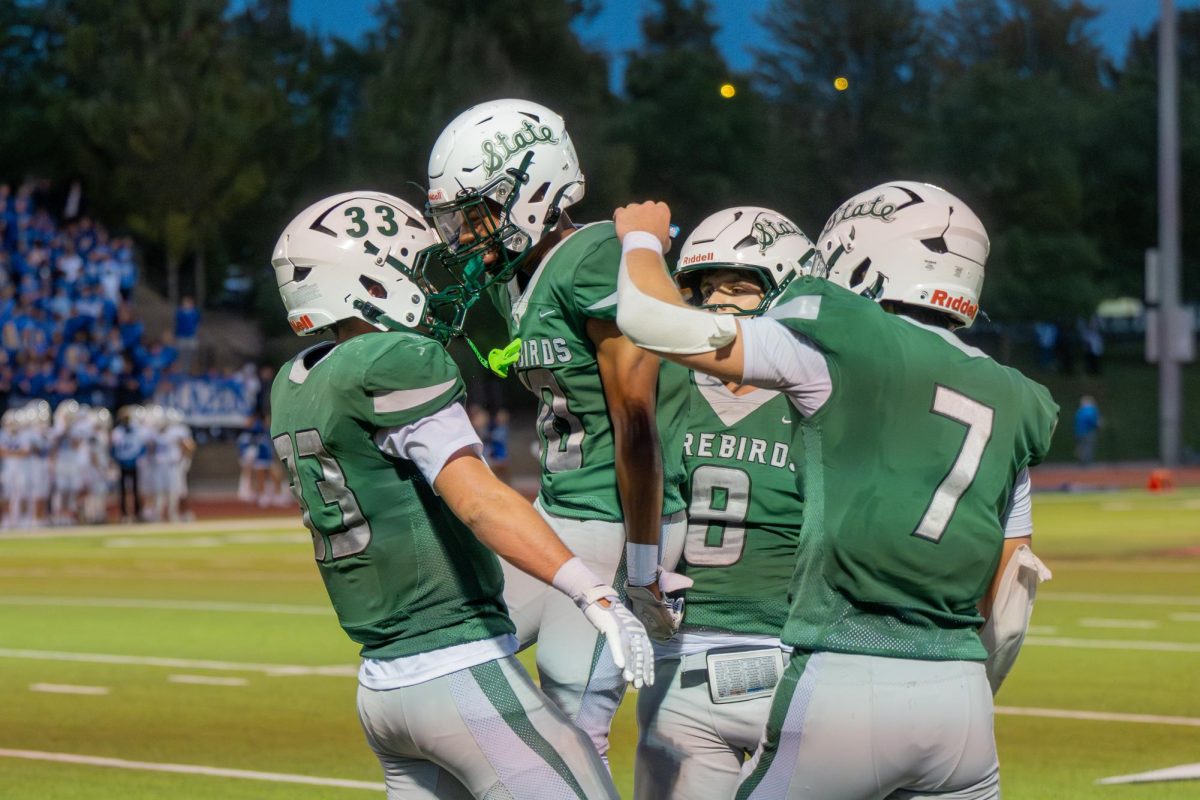 After a touchdown, members of the Varsity football team celebrate.