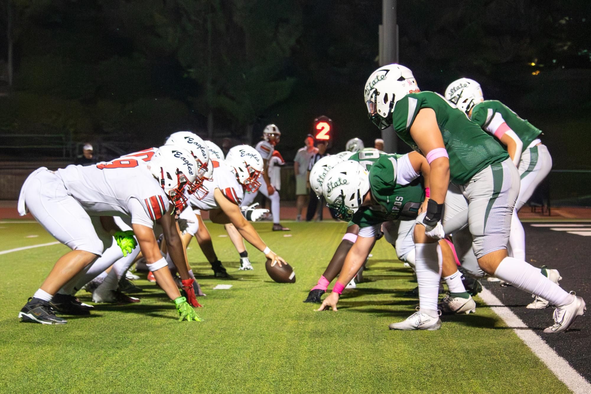 Facing off, Free State's opponents prepare to snap the ball.