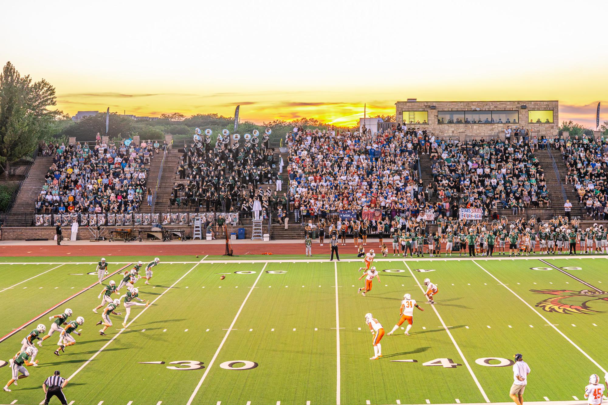 Starting the game, junior Micah Jones kicks the ball.