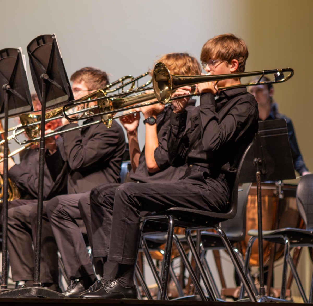 Following his sheet music, freshman Emmett Brown plays in the fall band concert on Oct. 6.