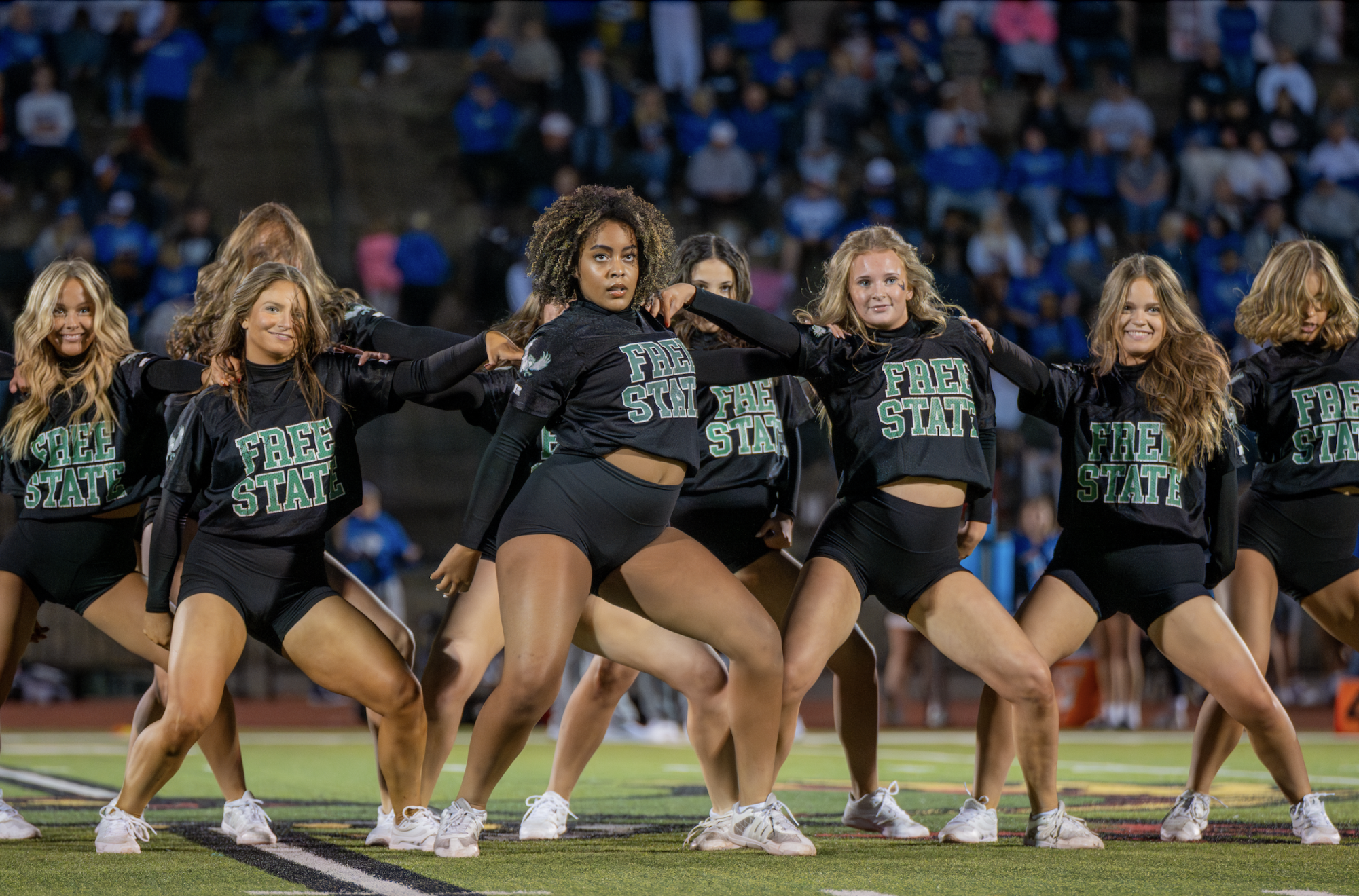 In the middle of their routine, the dance team performs at half time.