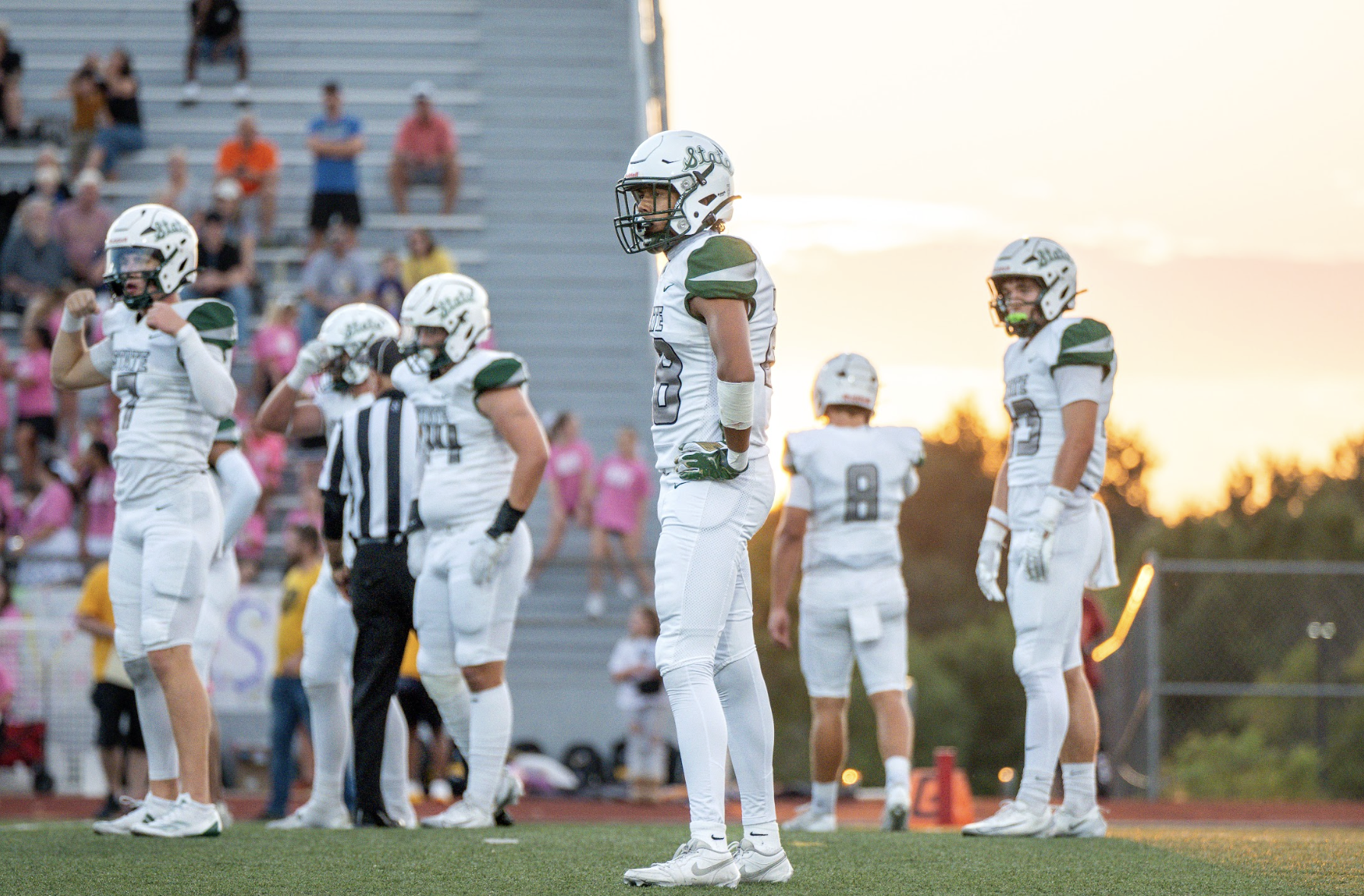 Preparing for kick-off, senior Greysen Rawls ponders at an away game against Shawnee Mission West on Sept. 19.
