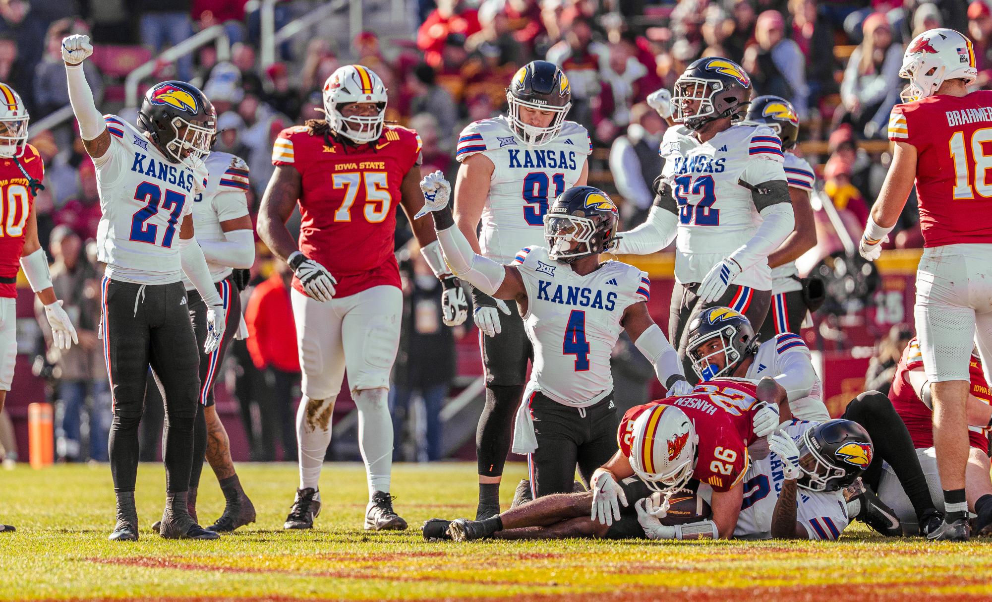 After a tackle, University of Kansas running back Leshon Williams and the rest of the Jayhawks celebrate during a football game against Iowa State on Nov. 22. The Jayhawks lost 38-14.