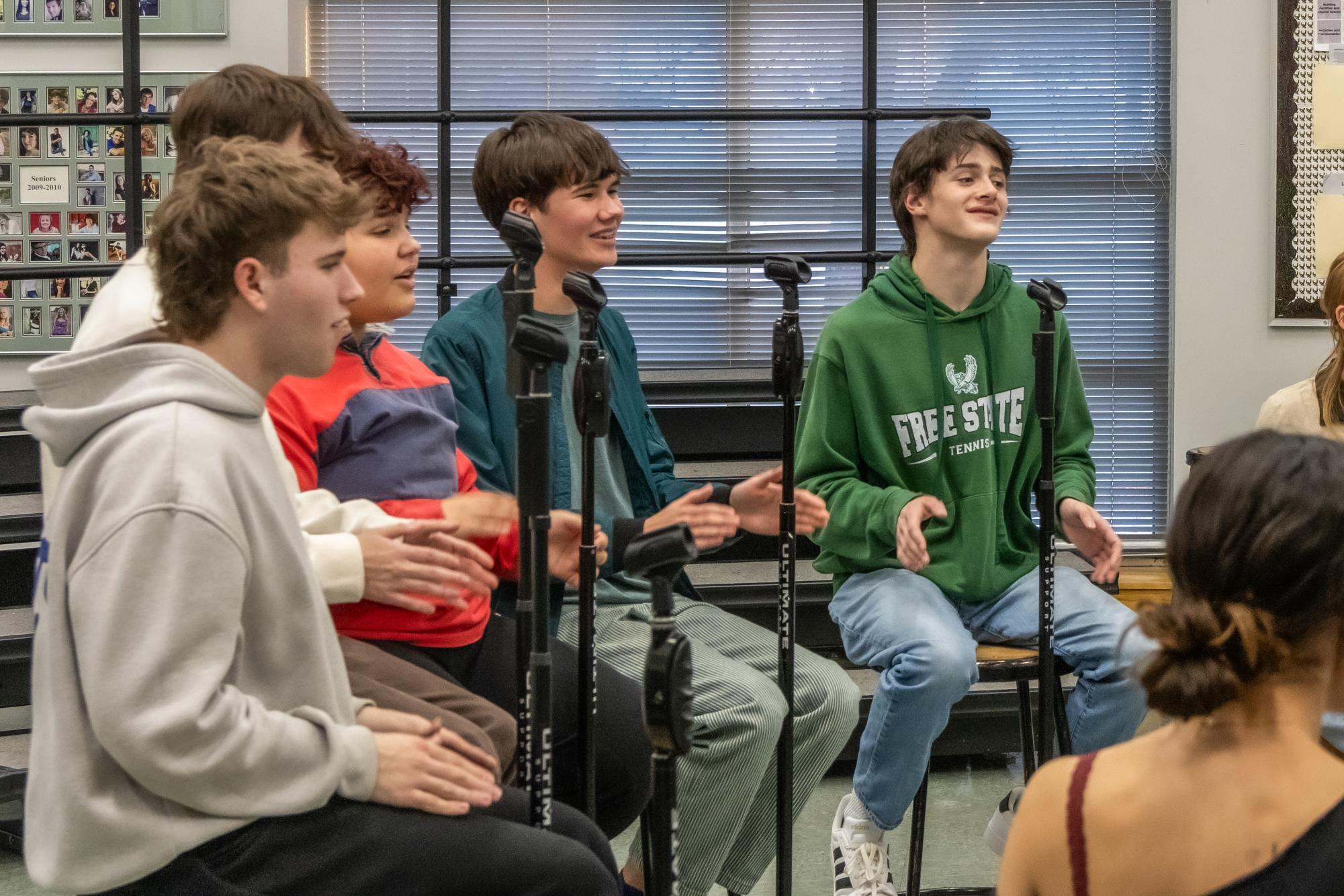 Practicing, seniors Colby Stuler, Owen Börk, Kouri Demelash, Anders Benson, and Felix Mueller sing in preparation for their upcoming Encore performance.