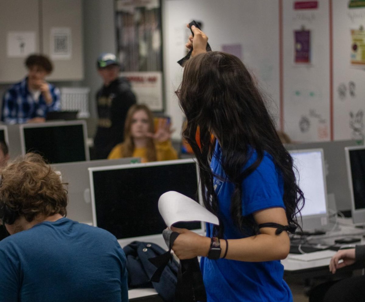 At Lawrence High, a student hands out black armbands in protest of Gaggle. Archive photo by Nathan Friedman.